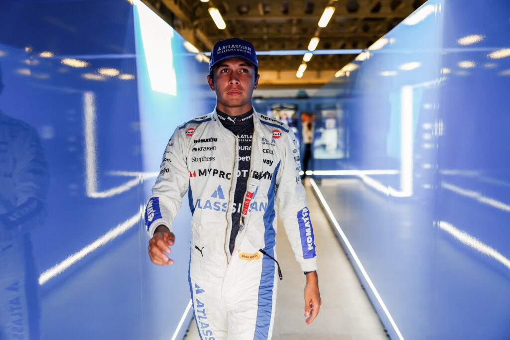Alex Albon walking through the Williams garage at the 2025 Formula 1 Azerbaijan Grand Prix