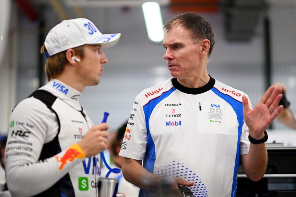 Racing Bulls team principal Alan Permane speaking to driver Liam Lawson at the 2025 Formula 1 Singapore Grand Prix