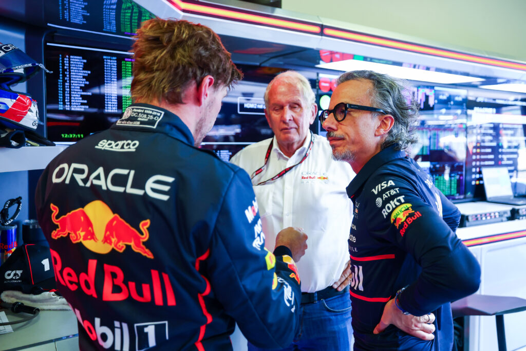 Max Verstappen speaks to Helmut Marko and Laurent Mekies in the Red Bull garage during practice at the 2025 F1 Mexico City Grand Prix