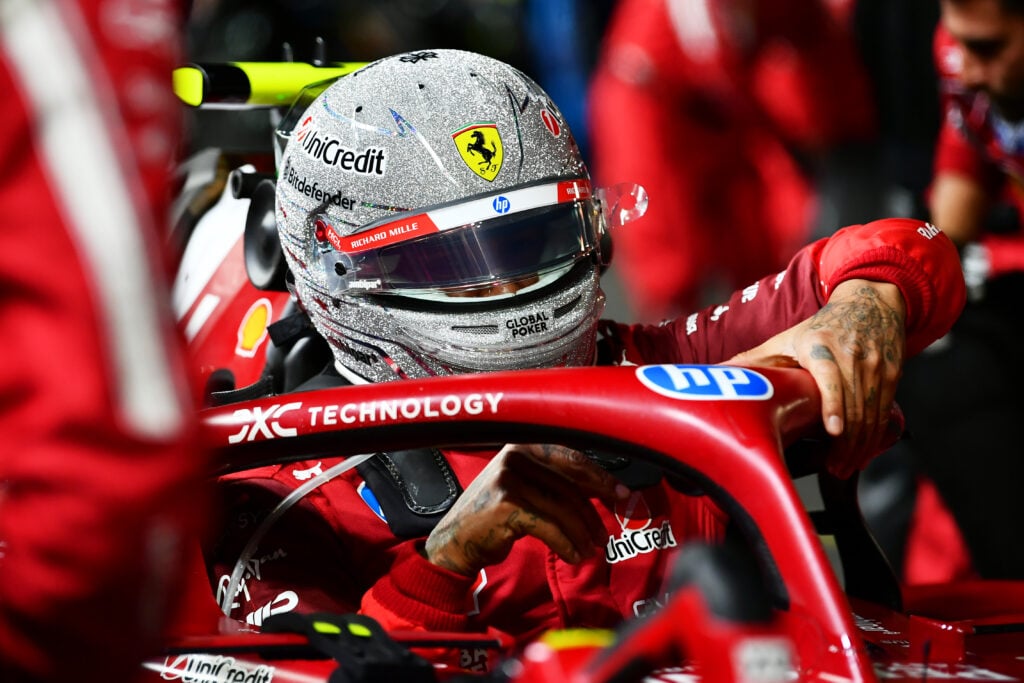 Ferrari driver Lewis Hamilton climbing into the car at the 2025 Formula 1 Las Vegas Grand Prix