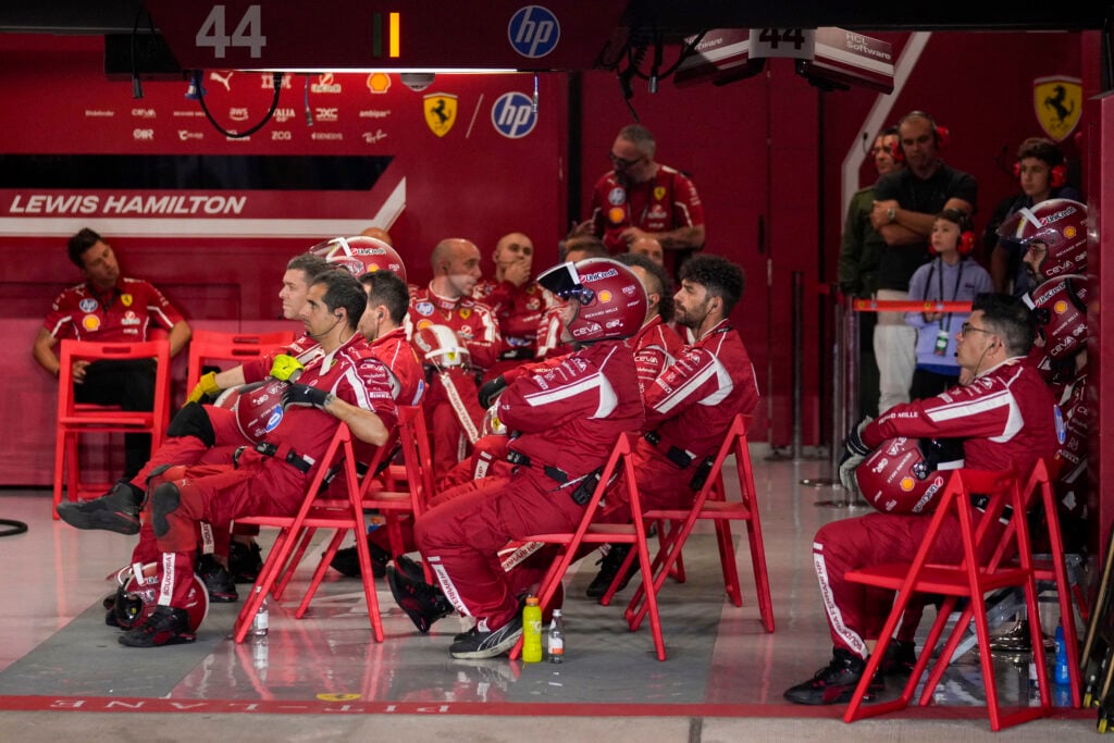 Lewis Hamilton's Ferrari mechanics watch the Qatar Grand Prix from the garage