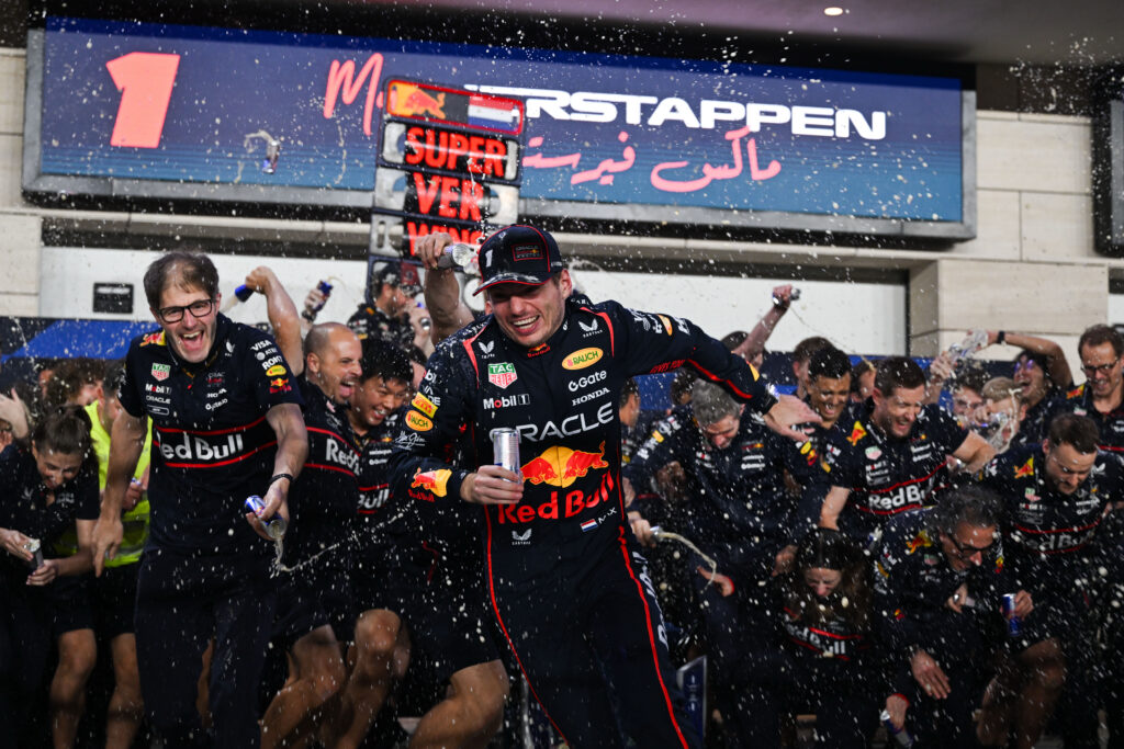 Red Bull driver Max Verstappen running away from the team's celebrations after winning the 2025 F1 Qatar Grand Prix