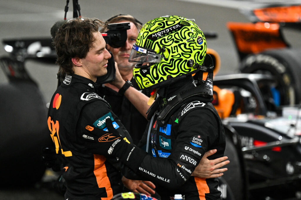 McLaren driver Oscar Piastri congratulates teammate Lando Norris after the 2025 Formula 1 Abu Dhabi Grand Prix