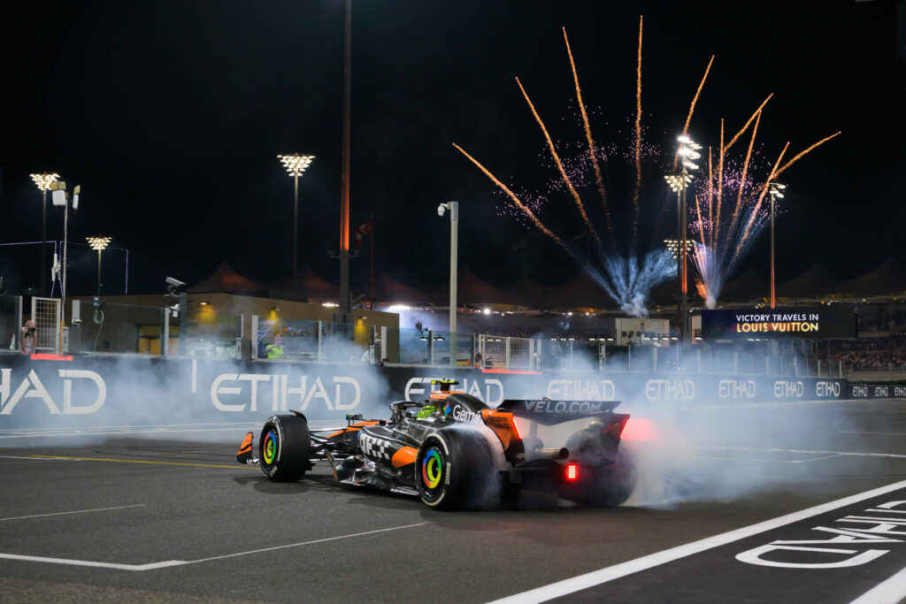 McLaren driver Lando Norris celebrates winning the 2025 F1 title with donuts after the Abu Dhabi Grand Prix