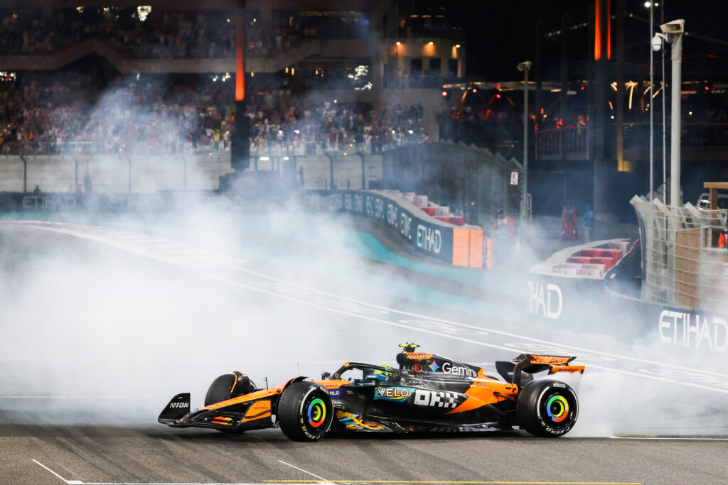 McLaren's Lando Norris does donuts to celebrate winning the 2025 F1 drivers' title after the Abu Dhabi Grand Prix