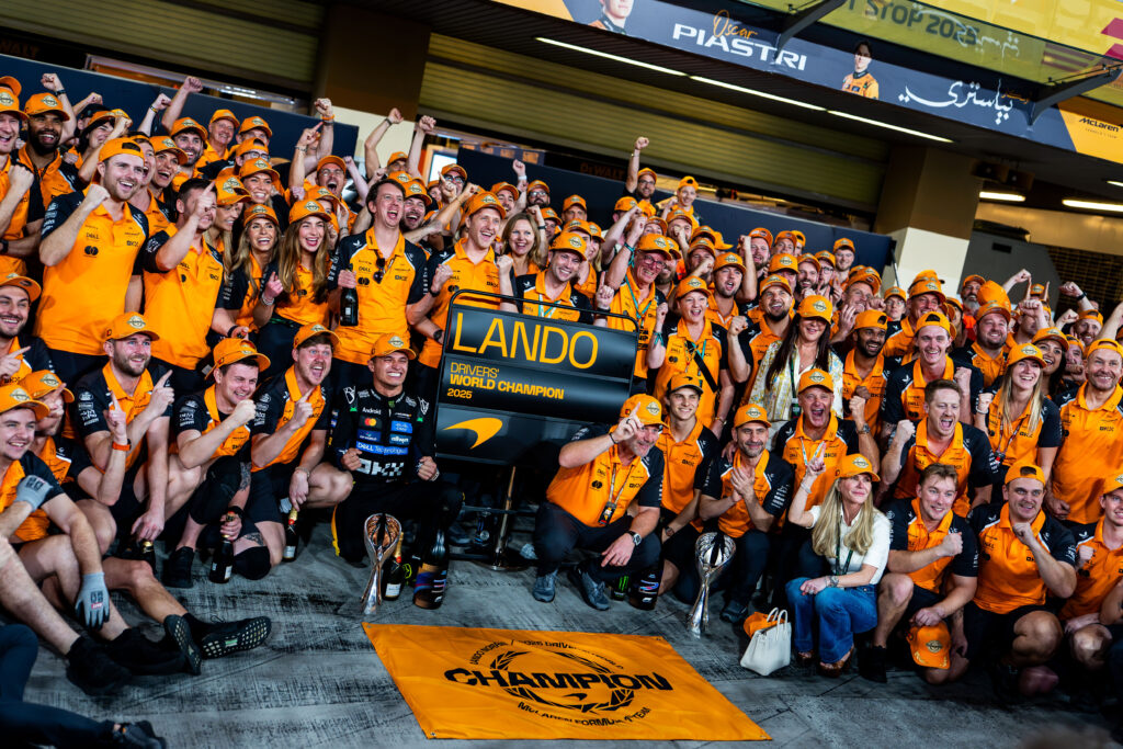 McLaren driver Lando Norris celebrates with his team after winning the 2025 F1 drivers' title at the Abu Dhabi Grand Prix