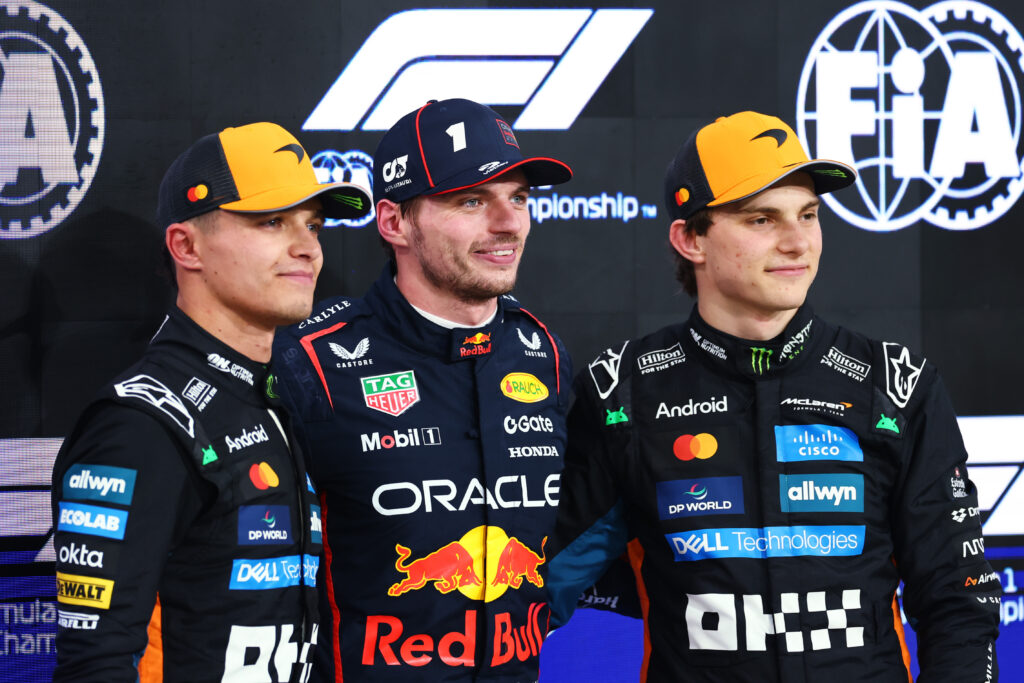 Red Bull driver Max Verstappen poses for a photo with McLaren's Lando Norris and Oscar Piastri after qualifying for the 2025 F1 Abu Dhabi Grand Prix
