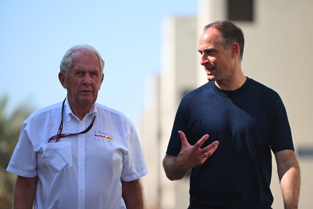 Helmut Marko and Oliver Mintzlaff walking through the paddock at the 2025 Formula 1 Abu Dhabi Grand Prix