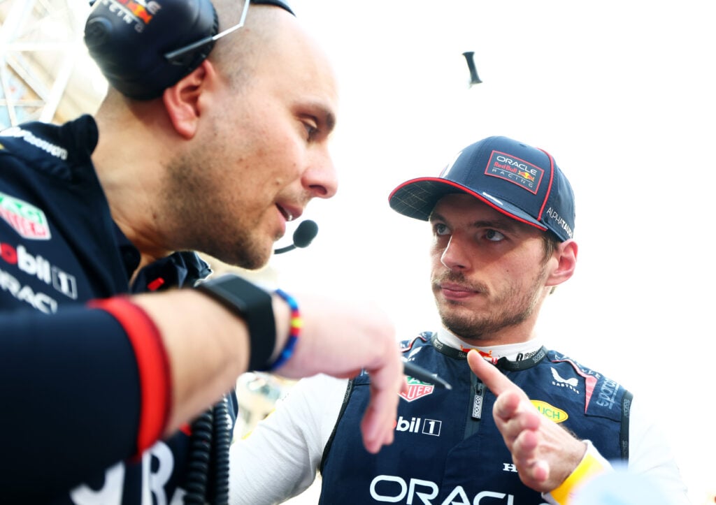 Max Verstappen speaks to race engineer Gianpiero Lambiase on the grid at the 2025 Abu Dhabi Grand Prix