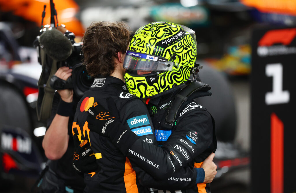 Lando Norris embraces Oscar Piastri in parc ferme after the 2025 Abu Dhabi Grand Prix