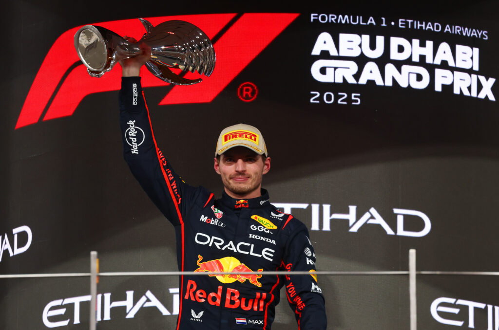 Red Bull driver Max Verstappen lifting his trophy at the 2025 Formula 1 Abu Dhabi Grand Prix