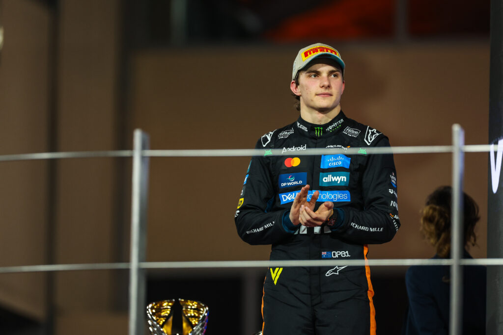 McLaren driver Oscar Piastri standing on the podium at the 2025 Formula 1 Abu Dhabi Grand Prix