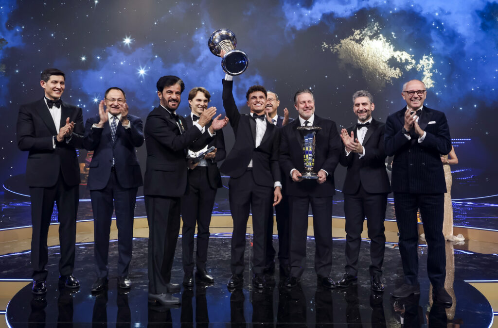 McLaren's Lando Norris lifts the F1 drivers' championship trophy at the 2015 FIA Awards gala