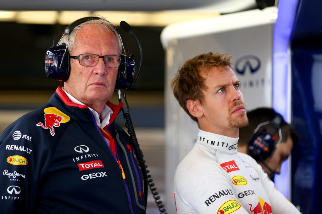 Helmut Marko and Sebastian Vettel in the Red Bull garage during practice at the 2014 F1 United States Grand Prix