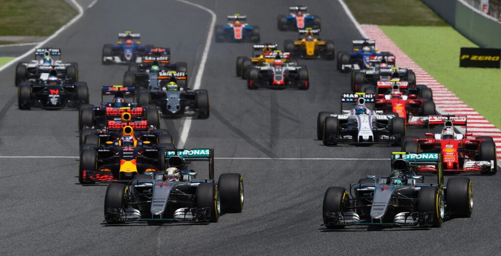 Mercedes driver Nico Rosberg overtakes teammate Lewis Hamilton at the start of the 2016 F1 Spanish Grand Prix