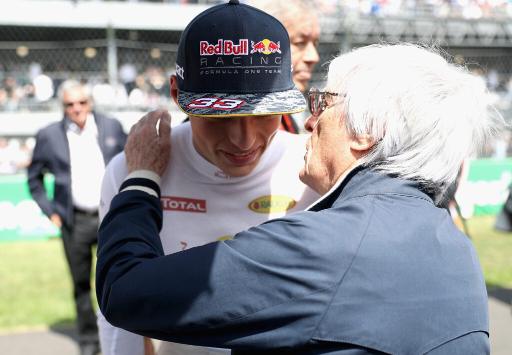 Bernie Ecclestone whispering in Max Verstappen's ear at the 2016 Mexican Grand Prix