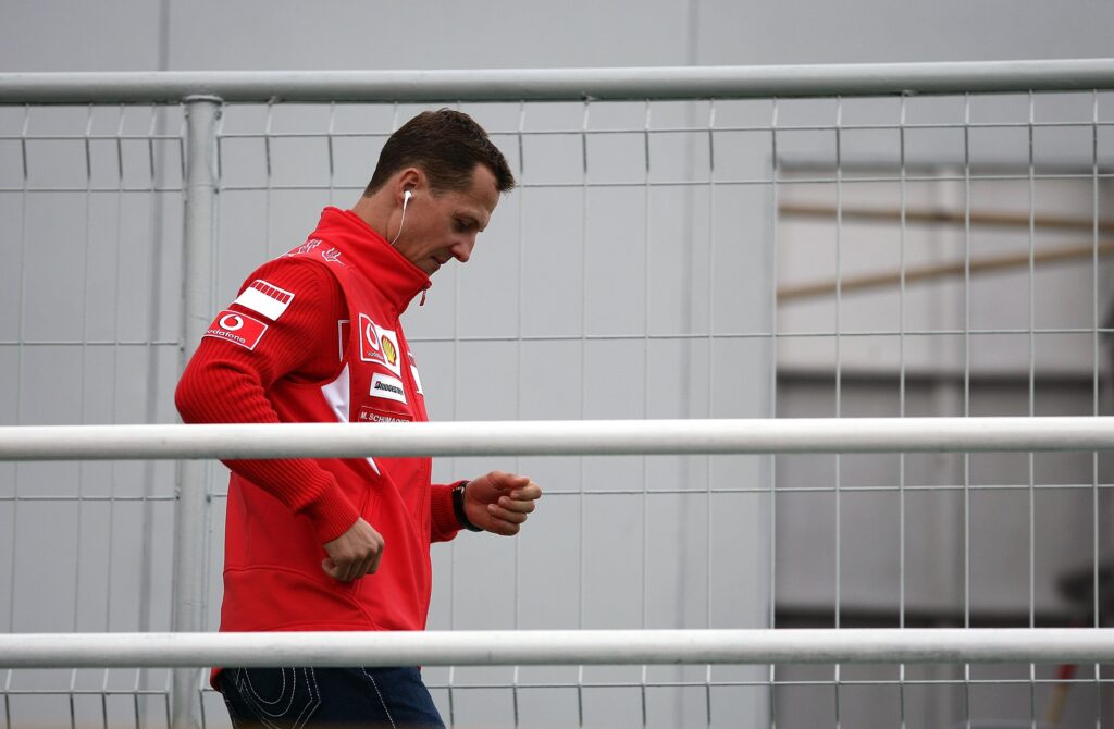 Ferrari driver Michael Schumacher walking through the paddock at the 2006 Brazilian Grand Prix