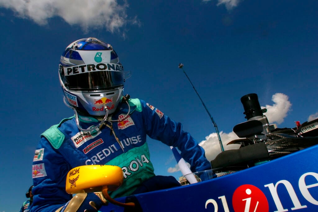 Kimi Raikkonen exiting his Sauber F1 car at the 2001 British Grand Prix.