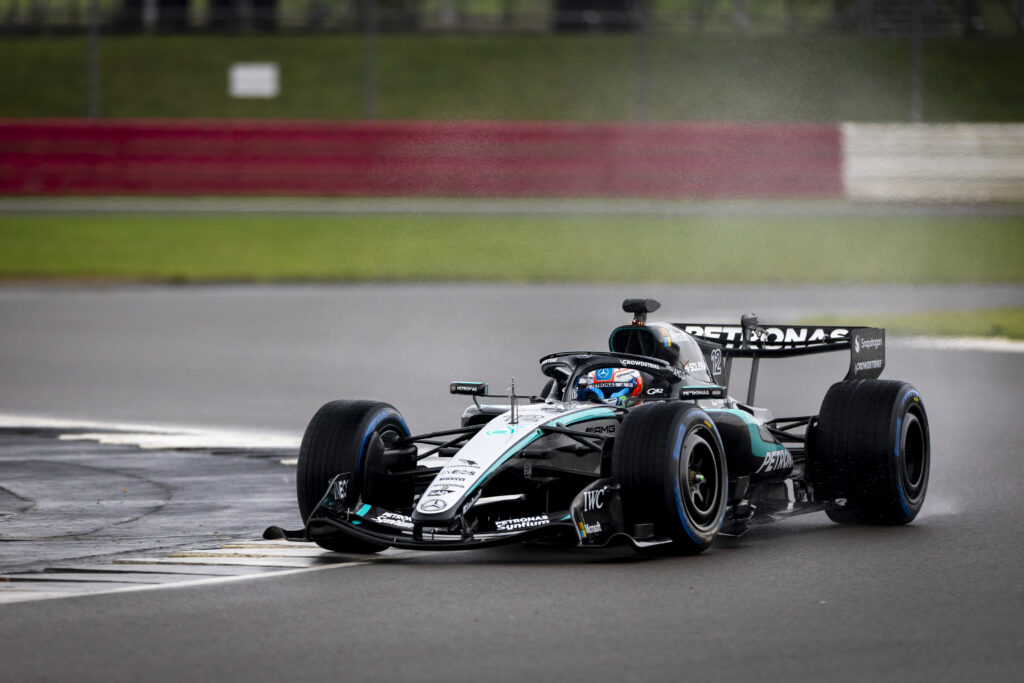 Kimi Antonelli at the wheel of the Mercedes W17 on a rainy Silverstone circuit during the F1 team's first shakedown of 2026.