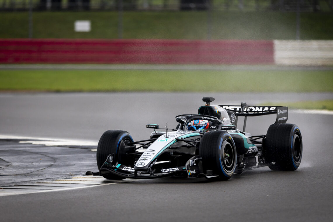 Kimi Antonelli at the wheel of the Mercedes W17 on a rainy Silverstone circuit during the F1 team's first shakedown of 2026.