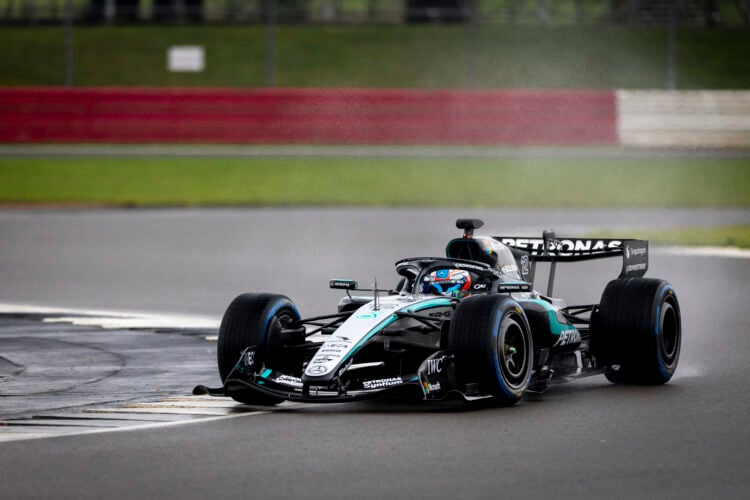 Kimi Antonelli at the wheel of the Mercedes W17 on a rainy Silverstone circuit during the F1 team's first shakedown of 2026.