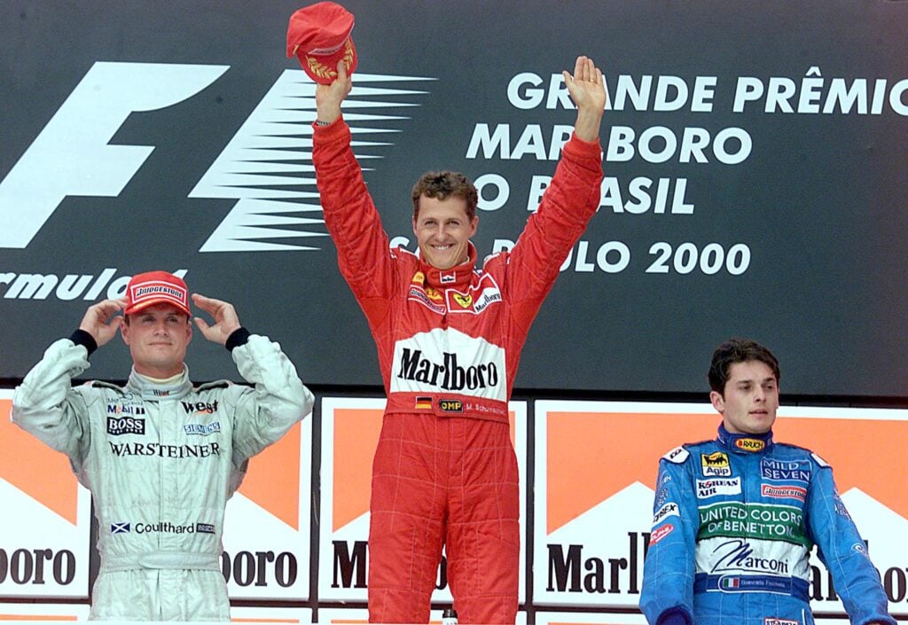 David Coulthard, Michael Schumacher, Giancarlo Fisichella on the podium at the 2000 British Grand Prix