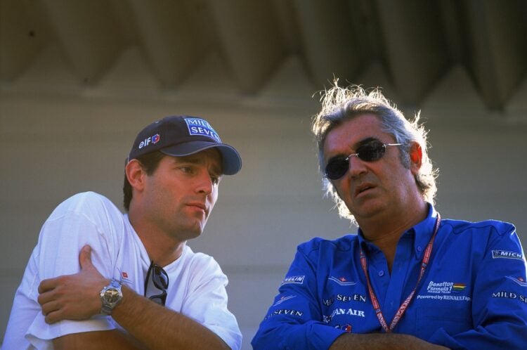 14 Oct 2001:  Benetton Test Driver Mark Webber talks with Team Boss Flavio Briatore before the Formula One Japanese Grand Prix held at Suzuka in Su...