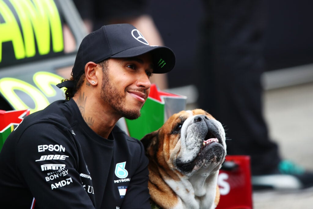Lewis Hamilton poses with his dog Roscoe at the 2020 Portuguese Grand Prix