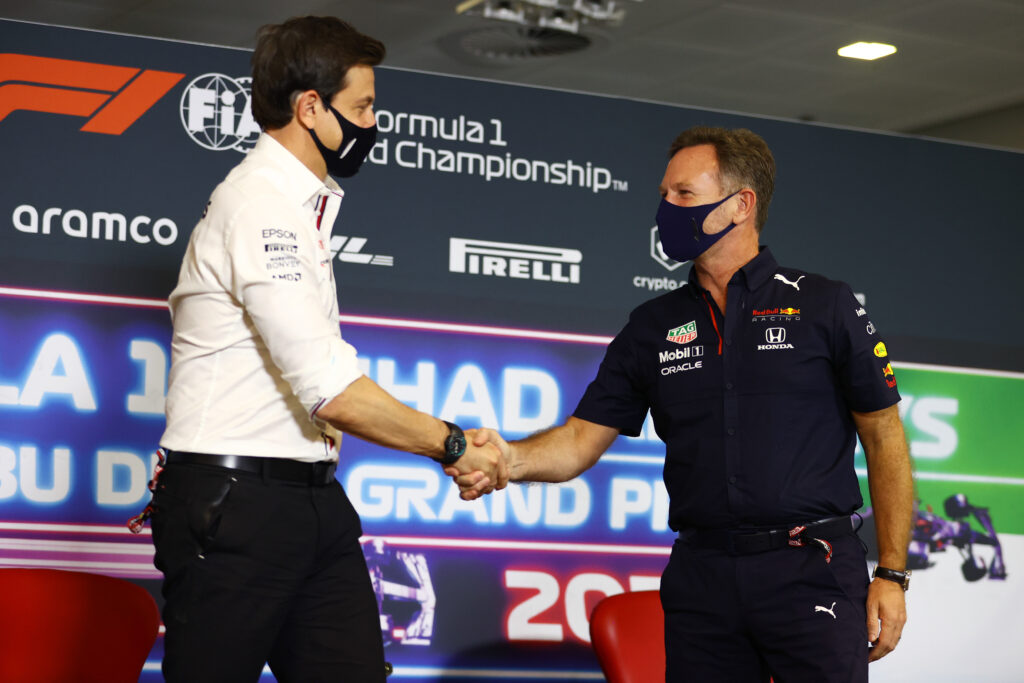 Mercedes team principal Toto Wolff shaking hands with Christian Horner at the 2021 Abu Dhabi Grand Prix