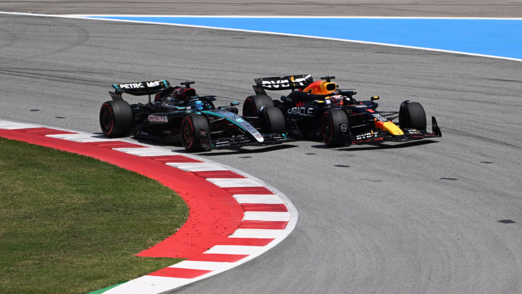 Mercedes driver George Russell and Red Bull driver Max Verstappen going wheel-to-wheel at the 2025 Formula 1 Spanish Grand Prix