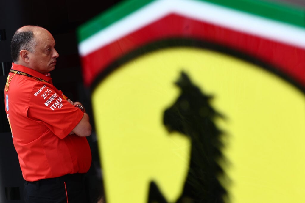 Fred Vasseur pictured by a Ferrari logo at the 2024 F1 Qatar Grand Prix