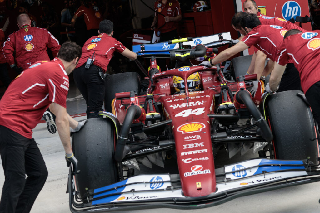 Ferrari engineers push Lewis Hamilton back into the garage during qualifying for the 2025 F1 Miami Grand Prix