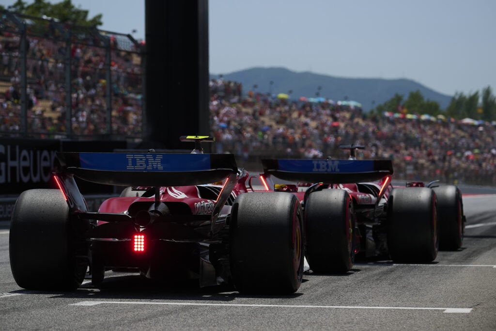 Ferrari drivers Lewis Hamilton and Charles Leclerc leave the pit lane at the 2025 F1 Spanish Grand Prix in Barcelona
