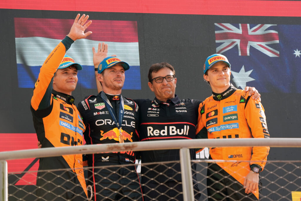 Lando Norris, Max Verstappen, Pierre Wache and Oscar Piastri on the podium at the 2025 Formula 1 Italian Grand Prix