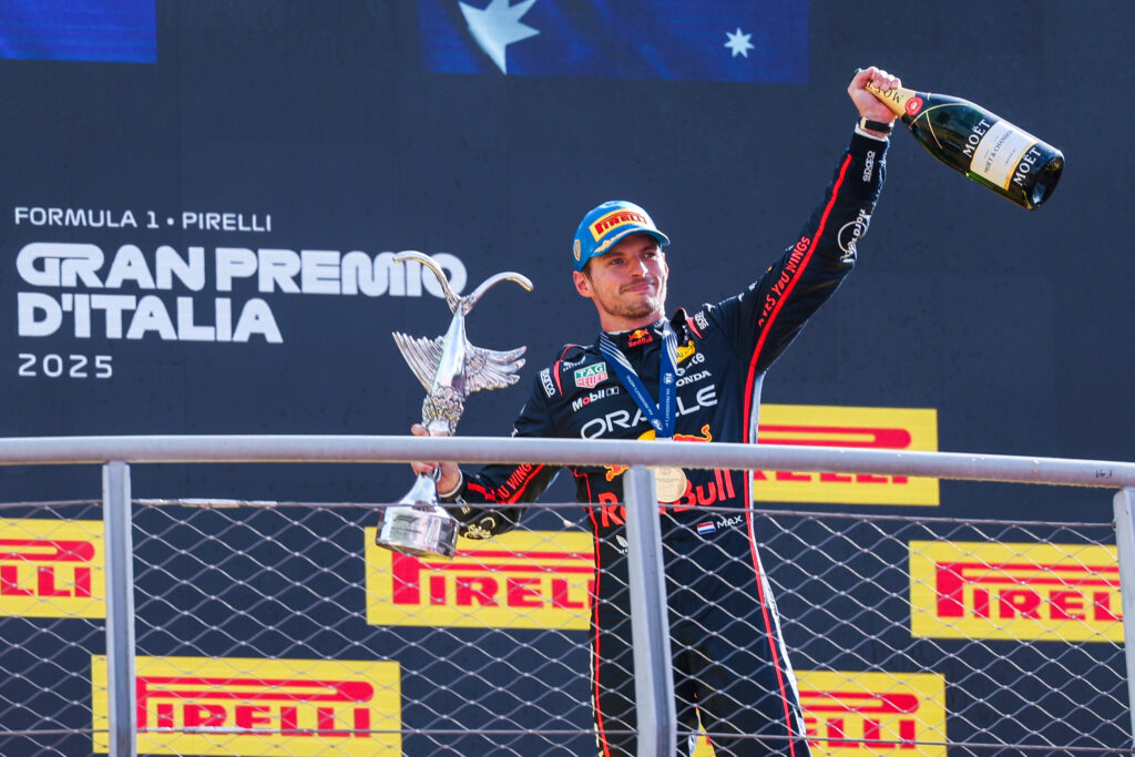 Red Bull driver Max Verstappen celebrating on the podium at the 2025 Formula 1 Italian Grand Prix