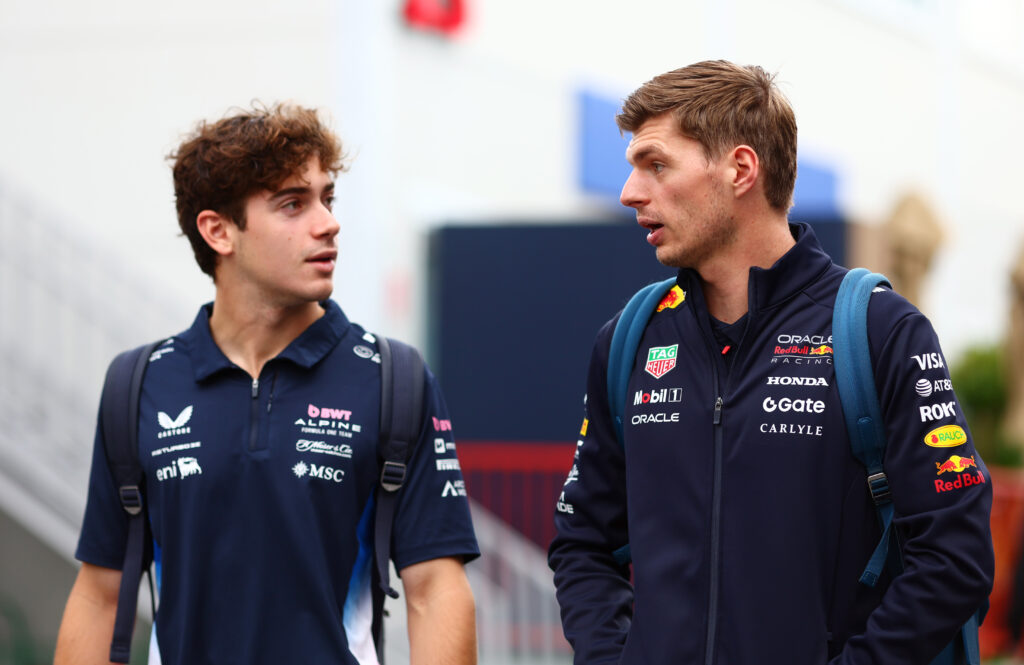 Max Verstappen speaks to Franco Colapinto in the paddock at the 2025 Azerbaijan Grand Prix