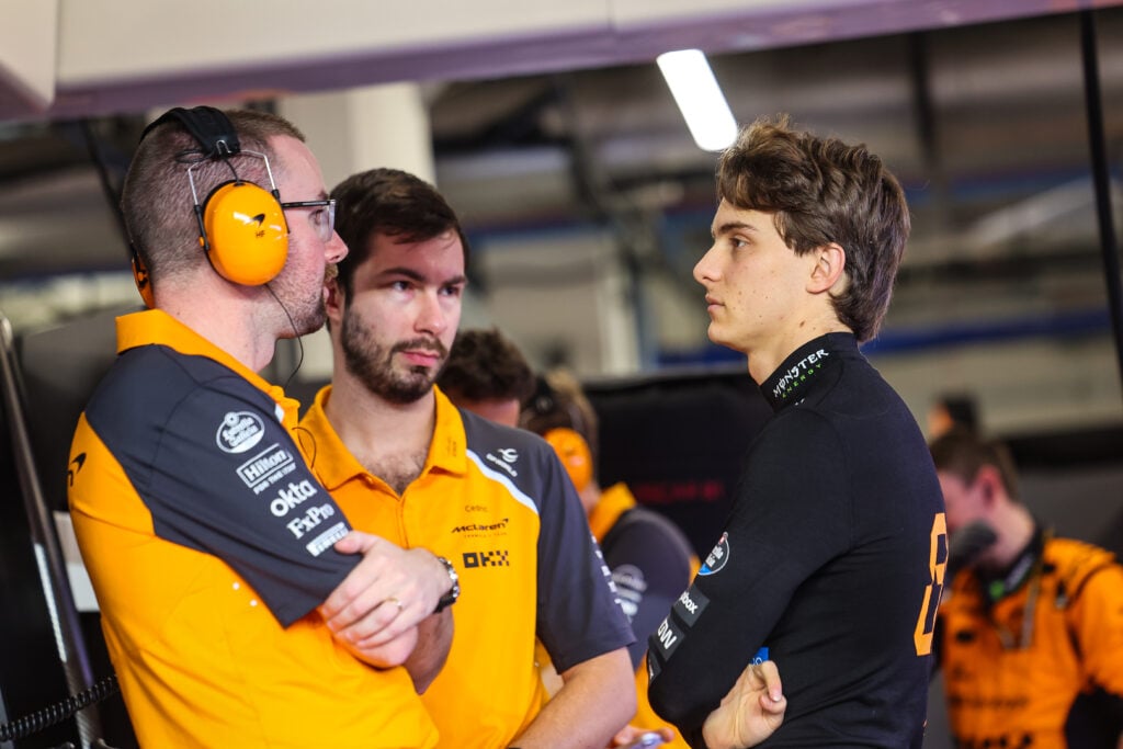 McLaren driver Oscar Piastri speaks to his engineers in the garage before the F1 Sprint at the 2025 Qatar Grand Prix