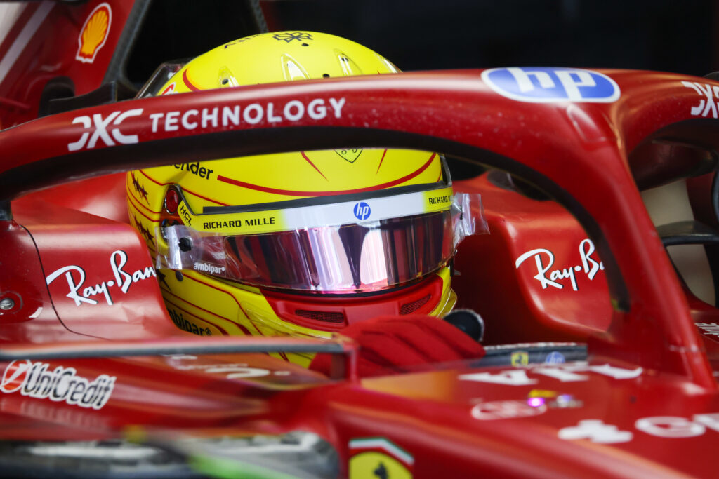 Ferrari driver Lewis Hamilton sits in his car during the 2025 F1 Abu Dhabi post-season test