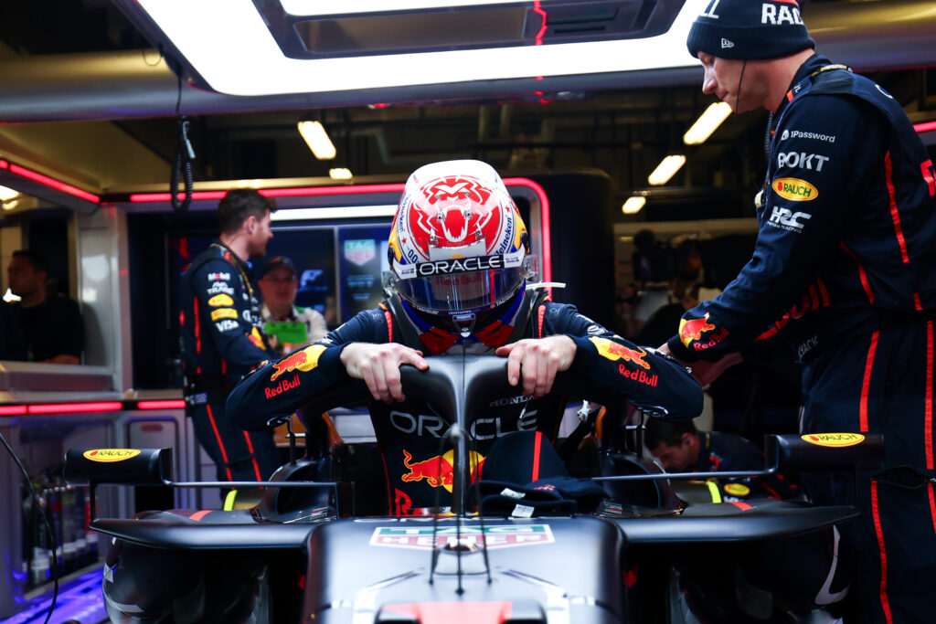 Max Verstappen getting into his Red Bull car at the 2025 F1 Grand Prix of Abu Dhabi