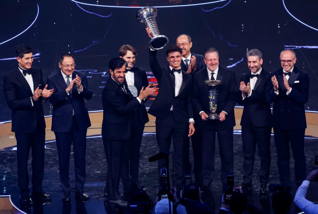 McLaren driver Lando Norris lifting the F1 drivers' championship at the FIA Awards 2025