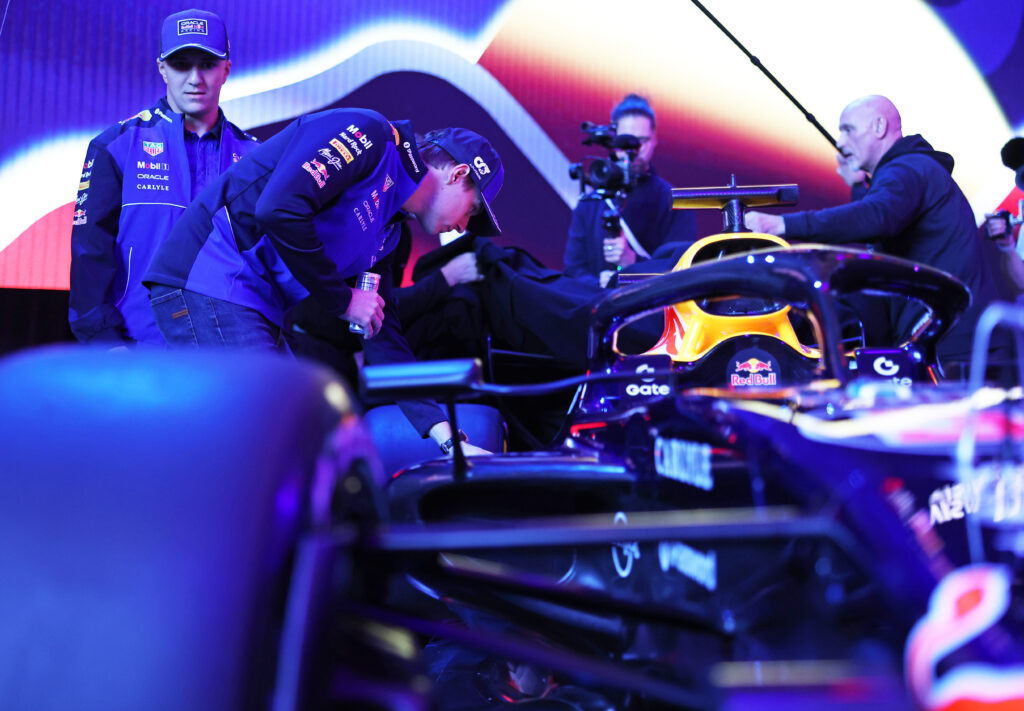 Red Bull driver Max Verstappen studies the RB22 during their 2026 F1 season launch event in Detroit