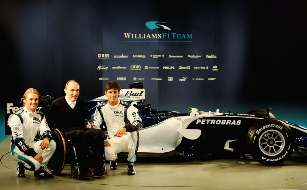 Nico Rosberg, Sir Frank Williams and Mark Webber at the launch of the 2006 Williams F1 car