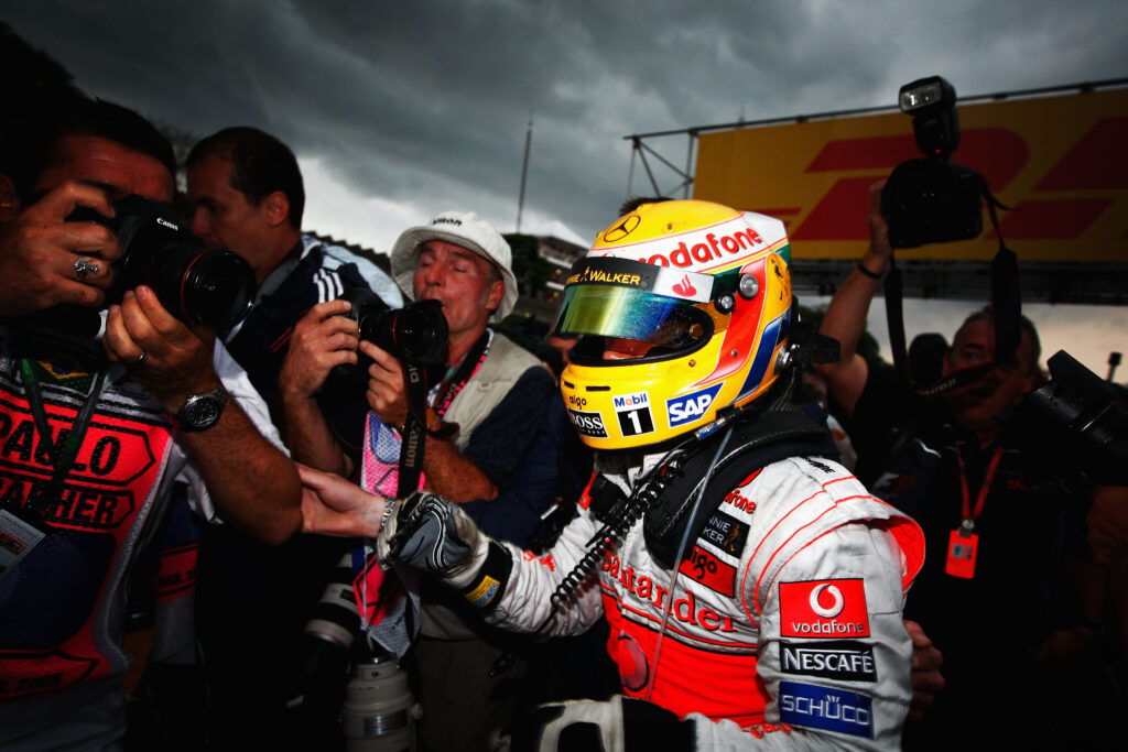 McLaren driver Lewis Hamilton celebrates winning the 2008 F1 drivers' title at the Brazilian Grand Prix