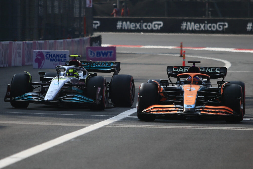 Lewis Hamilton and Daniel Ricciardo taking part in qualifying at the 2022 Mexico Grand Prix