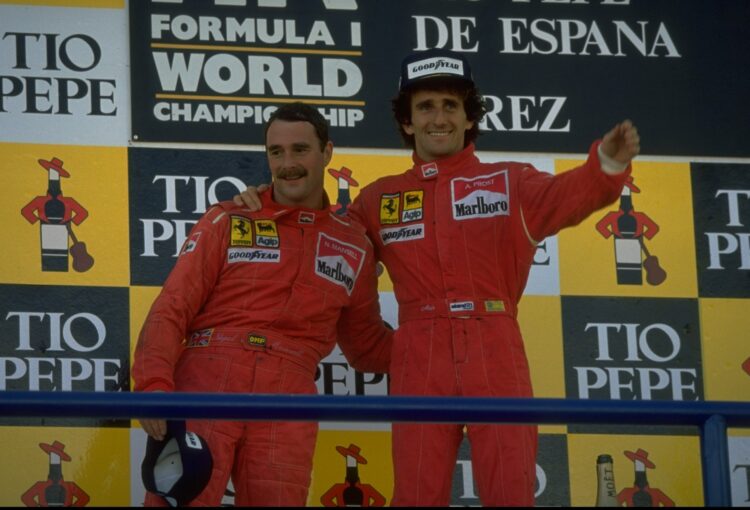 1990:  Scuderia Ferrari drivers Nigel Mansell (left) of Great Britain and Alain Prost (right) of France stand on the winners'' podium after the Spa...