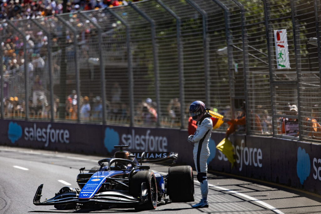 Alex Albon stands over his crashed Williams during practice at the 2024 F1 Australian Grand Prix