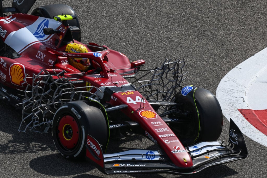 Lewis Hamilton drives his Ferrari with aero rakes behind the front tyres during 2025 testing in Bahrian