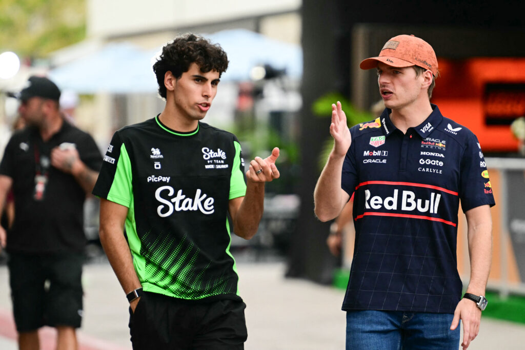 Sauber driver Gabriel Bortoleto speaking to Red Bull driver Max Verstappen at the 2025 Formula 1 United States Grand Prix