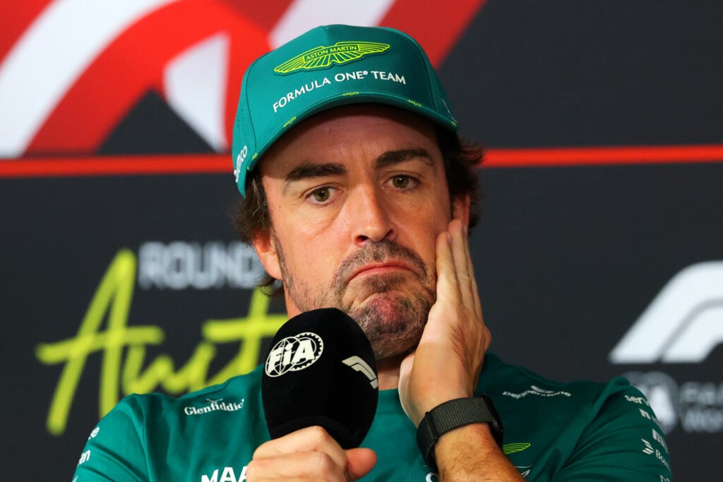 Fernando Alonso of Aston Martin sits in an F1 press conference