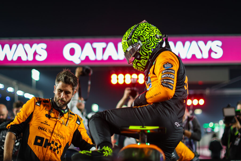 Lando Norris of Great Britain and McLaren climbs into the MCL39 in the pit lane during the F1 Grand Prix of Qatar at Lusail International Circuit on November 30, 2025.